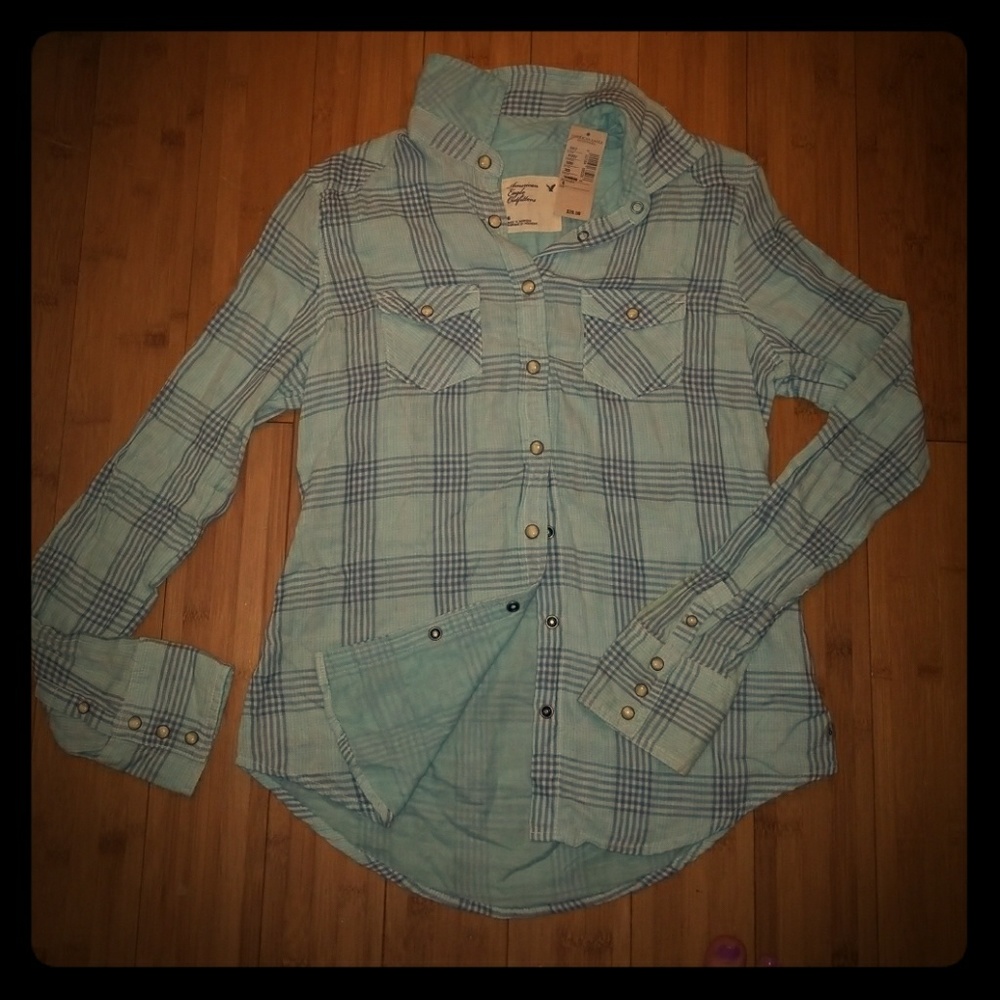 Light, plaid/western, snap button dress shirt.